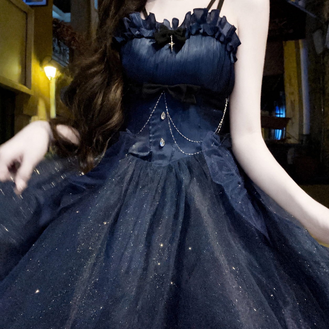 Close-up of the midnight-blue dress bodice and layered skirt