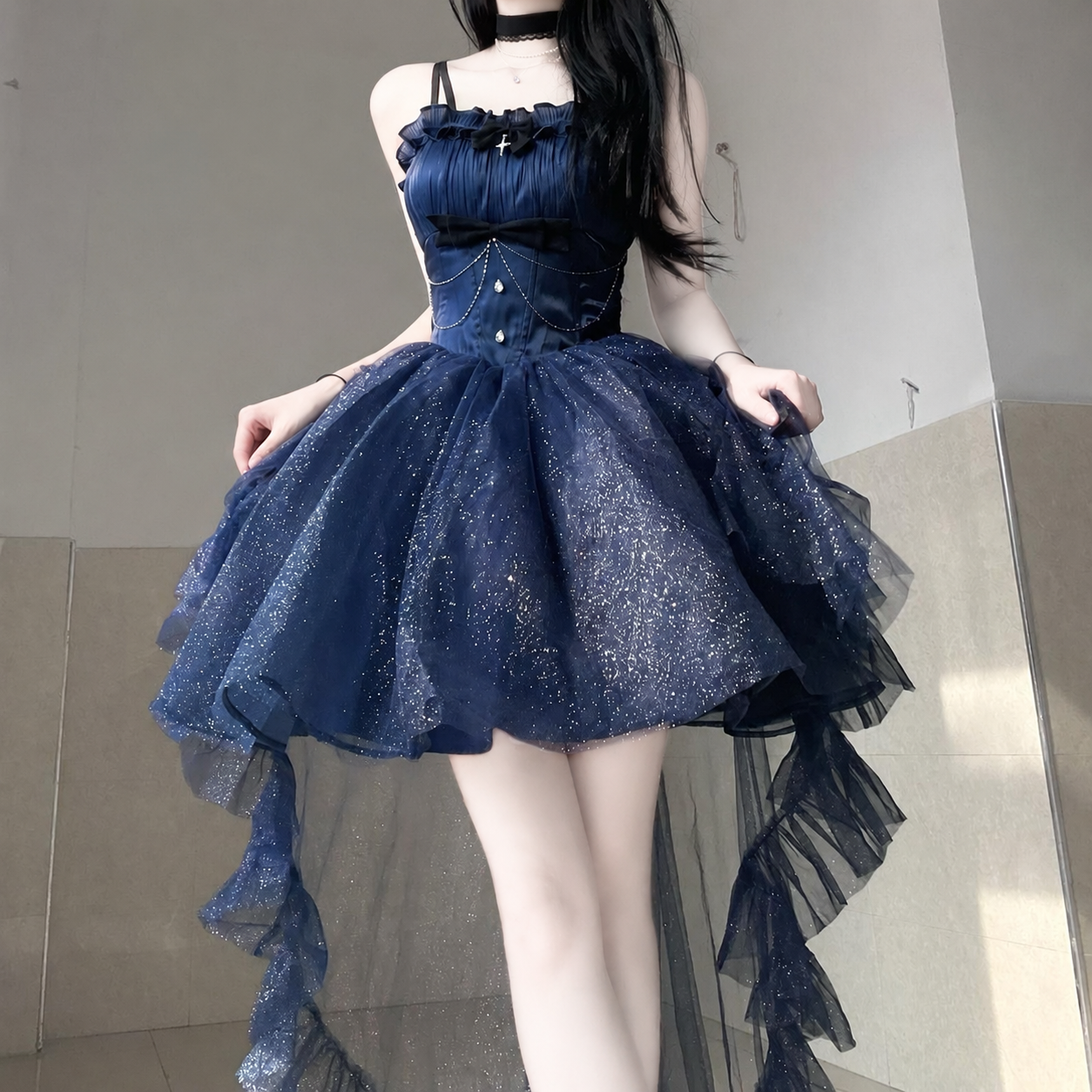 Front view of the midnight-blue dress with a layered high-low skirt