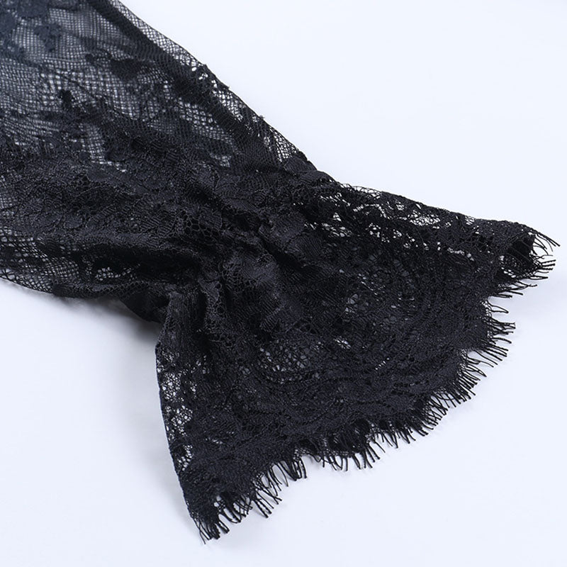 Close-up of the black floral lace sleeve and scalloped cuff