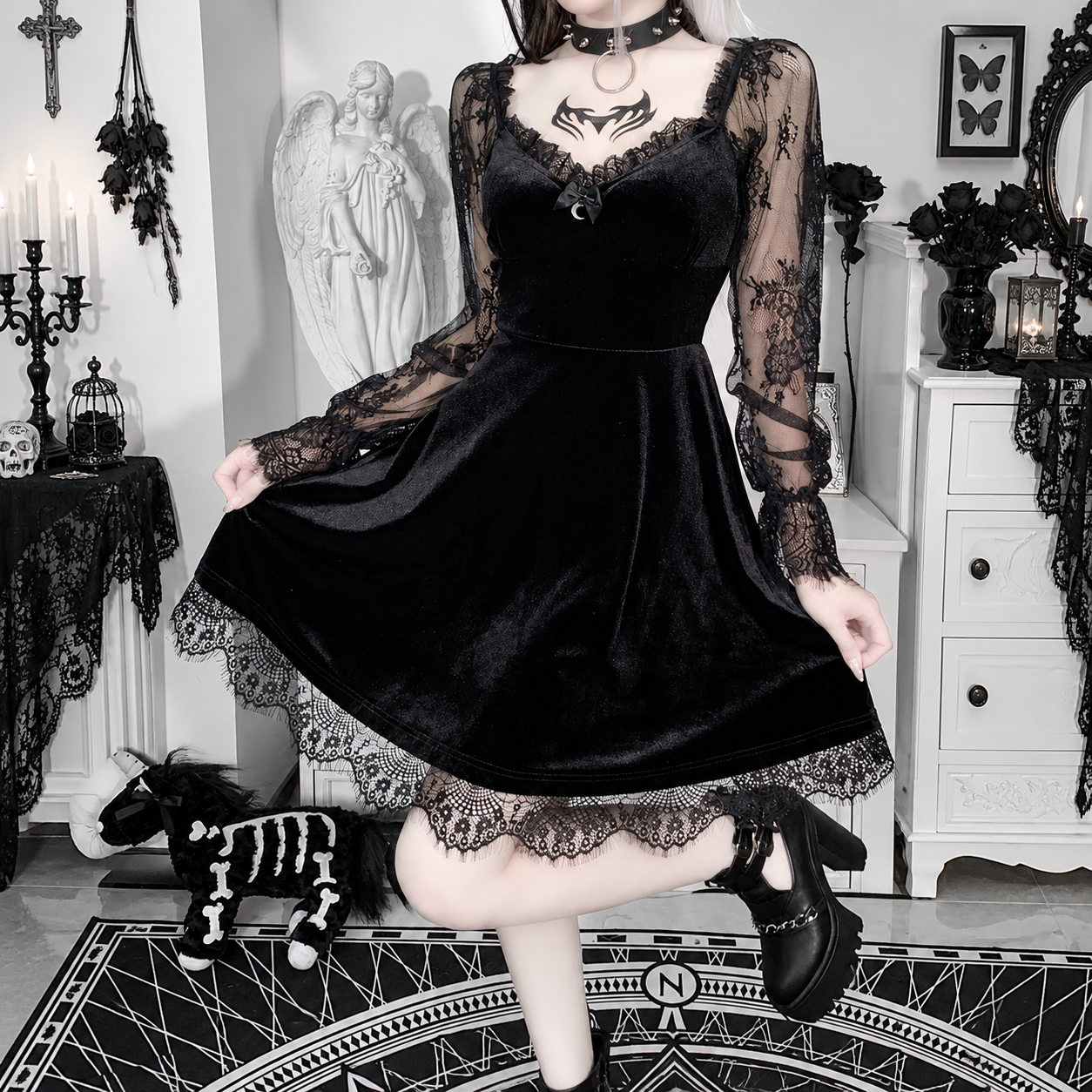 Black lace-trim velvet mini dress with sheer lace sleeves, shown from the front on an adult model